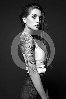 Young Woman with Tattoo. Black and white portrait