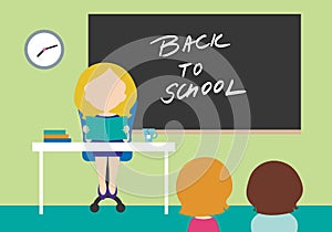 Young woman - teacher sitting on chair behind table in school cl