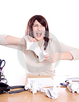 Young woman tearing paper