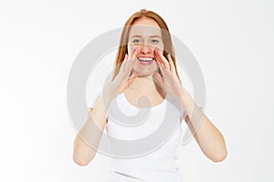Young woman telling something, red head girl telling a secret. Portrait young happy woman who is calling to someone. Funny girl