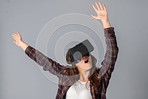 Young woman testing a virtual reality helmet
