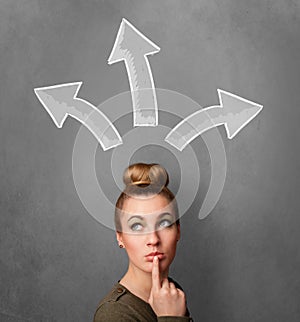 Young woman thinking with arrows above her head