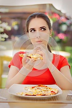 Young Woman Thinking About Eating Pizza on a Diet