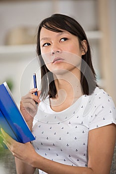 young woman thinking about something