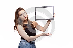 Young woman thinking or wondering about something with frame for your text or image