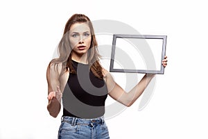 Young woman thinking or wondering about something with frame for your text or image