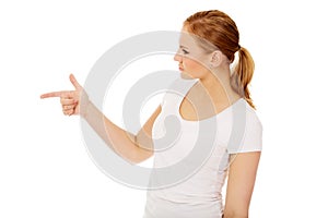 Young woman threatens someone the finger