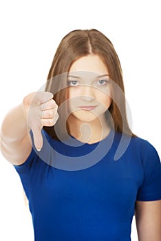 Young woman with thumbs down.