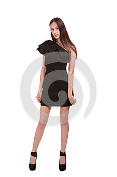 Young woman in tight black dress on white background