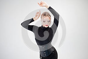 Young woman in tight clothes, black silhouette on white background.