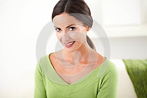 Young woman with toothy smile looking at camera