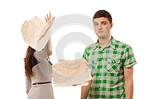 Young woman tossing aside papers