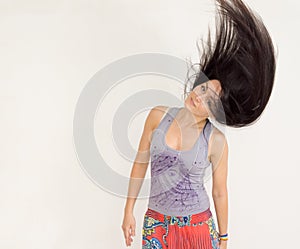 Young woman tossing her hair