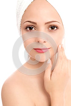 Young woman touching face