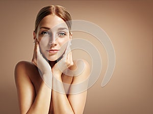 Young woman touching her face and looking stright