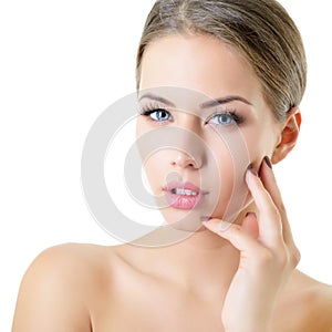 Young woman touching her face and neck. Beauty treatment for young beautiful female face. Skin care, beautician treatments, body