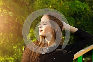 Young woman touching her hair