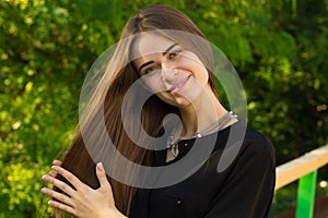 Young woman touching her hair