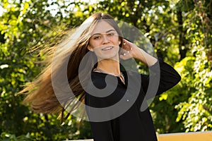 Young woman touching her hair