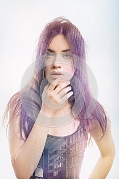 Young woman touching her lips and having messy hair