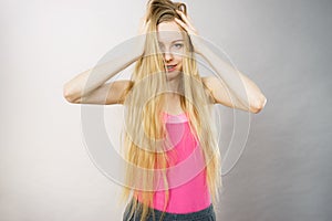 Young woman touching her long hair