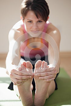 Young Woman Touching Her Toes