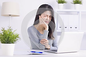 Young woman touching mouth with hand with painful expression because of toothache or dental illness on teeth