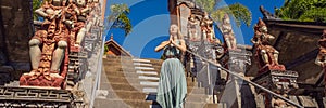 Young woman tourist in budhist temple Brahma Vihara Arama Bali BANNER, LONG FORMAT