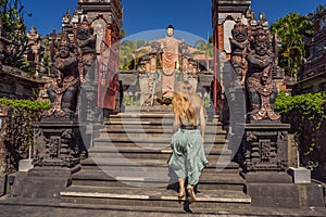 Young woman tourist in budhist temple Brahma Vihara Arama Banjar Bali, Indonesia