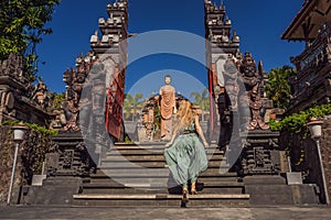 Young woman tourist in budhist temple Brahma Vihara Arama Banjar Bali, Indonesia