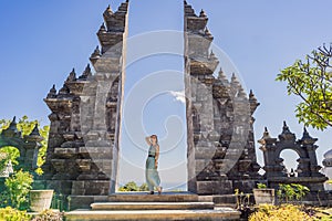 Young woman tourist in budhist temple Brahma Vihara Arama Banjar Bali, Indonesia