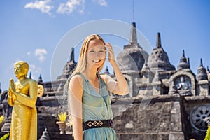 Young woman tourist in budhist temple Brahma Vihara Arama Banjar Bali, Indonesia