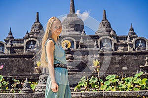 Young woman tourist in budhist temple Brahma Vihara Arama Banjar Bali, Indonesia