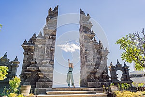 Young woman tourist in budhist temple Brahma Vihara Arama Banjar Bali, Indonesia