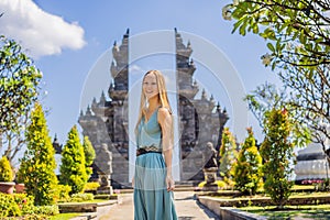 Young woman tourist in budhist temple Brahma Vihara Arama Banjar Bali, Indonesia