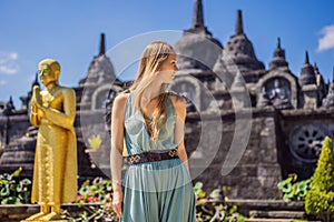 Young woman tourist in budhist temple Brahma Vihara Arama Banjar Bali, Indonesia