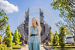 Young woman tourist in budhist temple Brahma Vihara Arama Banjar Bali, Indonesia