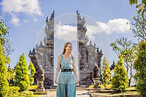 Young woman tourist in budhist temple Brahma Vihara Arama Banjar Bali, Indonesia