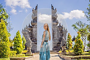 Young woman tourist in budhist temple Brahma Vihara Arama Banjar Bali, Indonesia