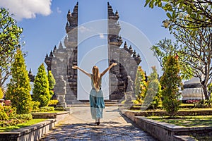 Young woman tourist in budhist temple Brahma Vihara Arama Banjar Bali, Indonesia