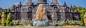 Young woman tourist in budhist temple Brahma Vihara Arama Banjar Bali, Indonesia BANNER, LONG FORMAT