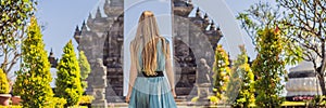 Young woman tourist in budhist temple Brahma Vihara Arama Banjar Bali, Indonesia BANNER, LONG FORMAT