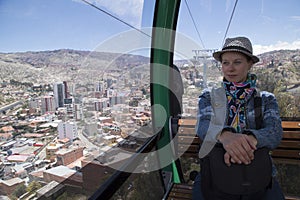 Woman tourist in La Paz Teleferico Cable car, Bolivia photo