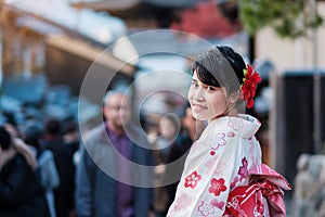 Young woman tourist wearing kimono enjoy in Yasaka pagoda area near Kiyomizu dera temple, Kyoto, Japan. Asian girl with hair style