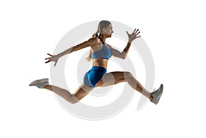 Young woman track athlete training isolated over white studio background.