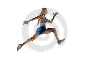 Young woman track athlete training isolated over white studio background.