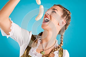 Young woman in traditional clothes or dirndl