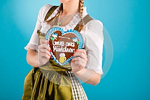 Young woman in traditional clothes or dirndl