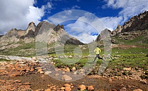 Runner running at high altitude mountains photo