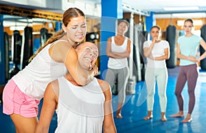 Young woman training chokehold